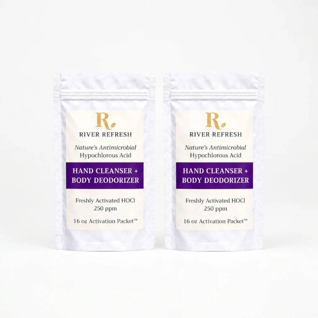 River Refresh Hypochlorous Acid Hand Cleanser + Body Deodorizer 32oz Refill products arranged on a white background: two stand-up pouches with each 16oz Activation Packets. The labels read River Refresh Hand Cleanser + Body Deodorizer, with Nature's Antimicrobial Hypochlorous Acid and HOCl 250 ppm visible.