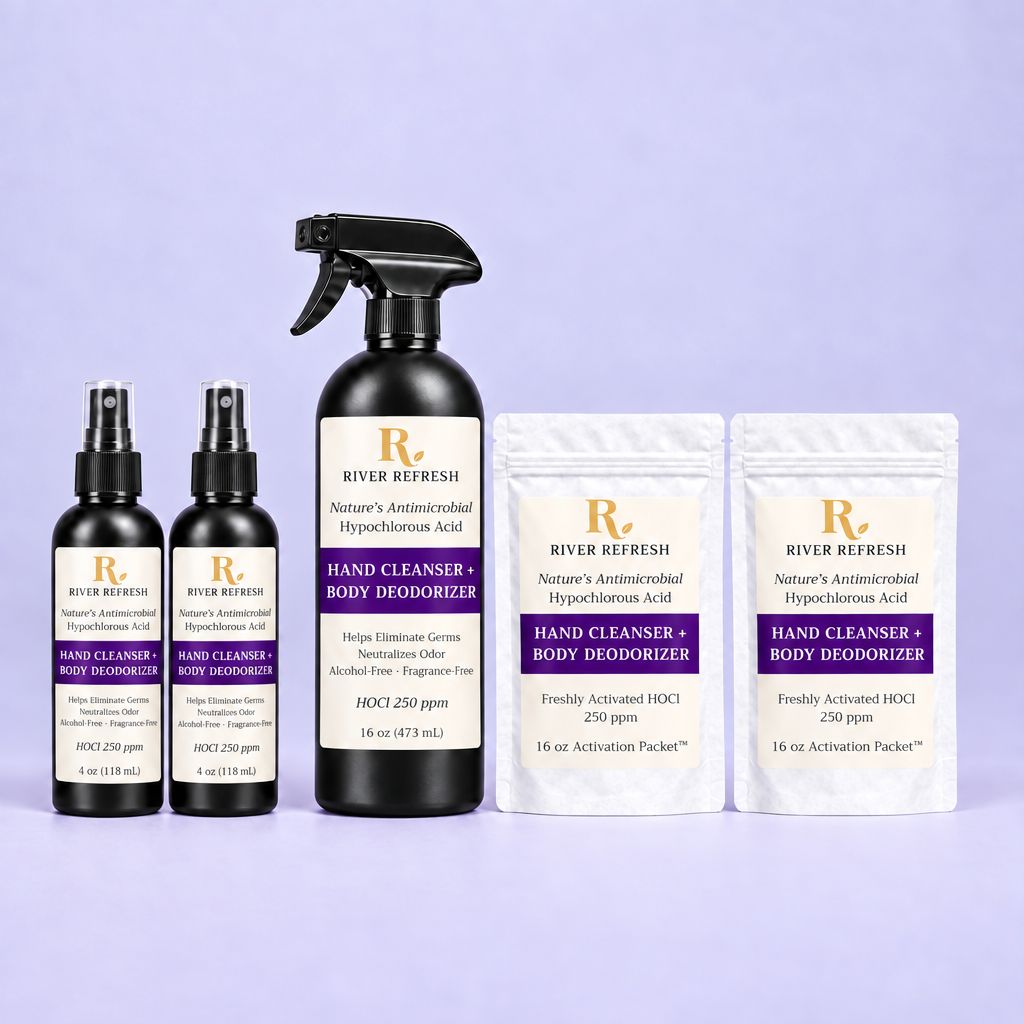 A set of River Refresh body care products arranged on a light lavender background: two 4oz black spray bottles, one 16oz black spray bottle, and two white stand-up pouches. The labels read River Refresh and Hand Cleanser Body Deodorizer, with Nature's Antimicrobial Hypochlorous Acid and HOCl 250 ppm visible.