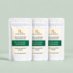 Three white stand-up pouches of River Refresh Pet Cleanser + Deodorizer are arranged in a row against a solid sage green background.