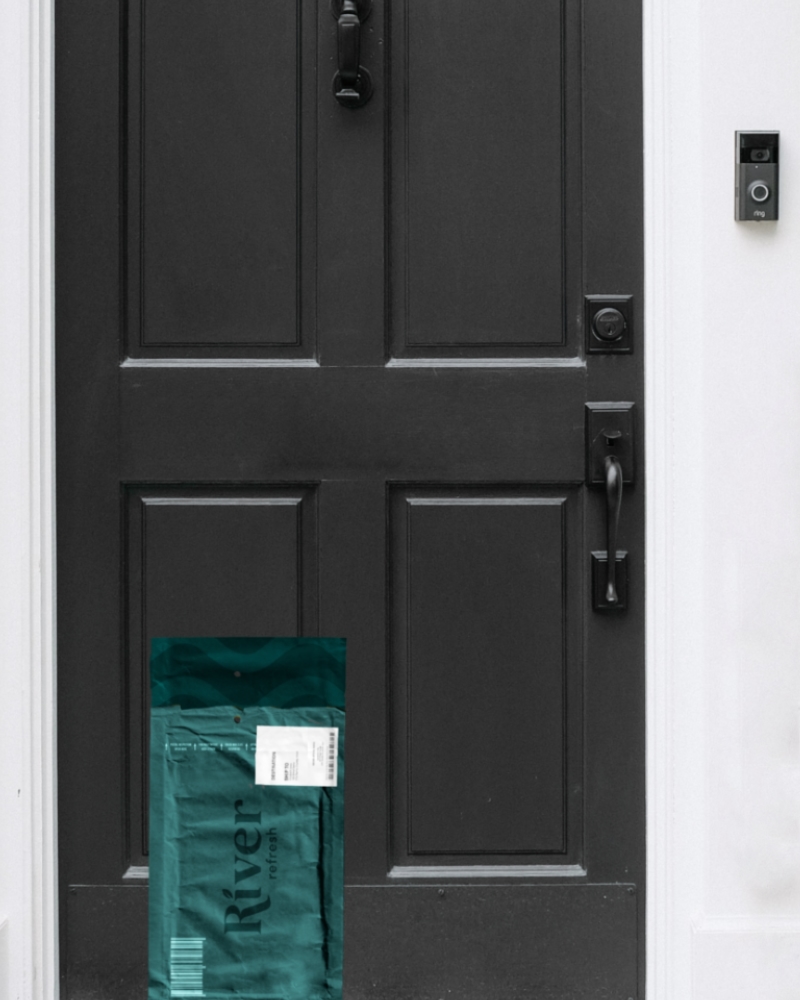 A door with a bag on the front of it