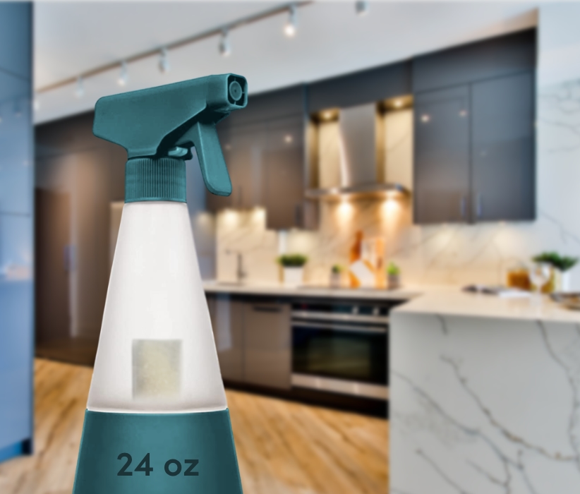 A spray bottle in the foreground of a kitchen.